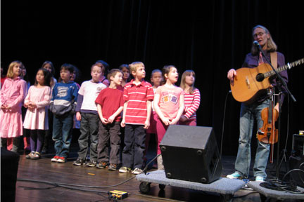 Lowry Olafson and students on stage
